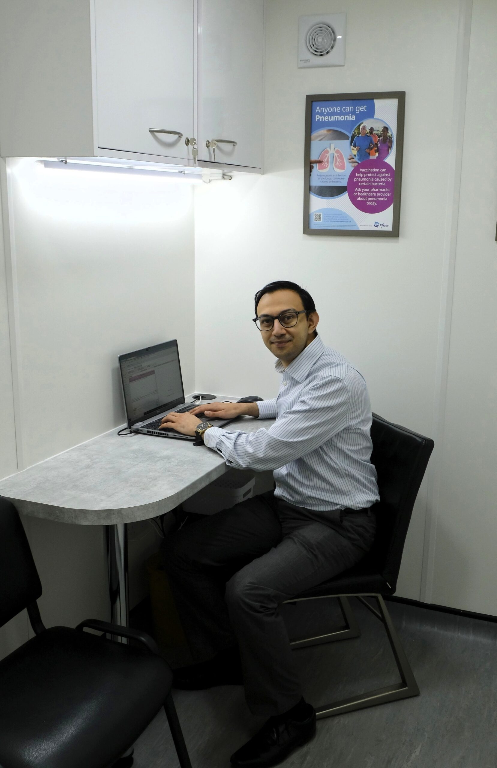Jatish Shelat, MPharm working in the pharmacy consultation room